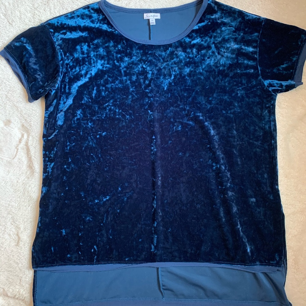 A blue shirt with the brand love, fire!